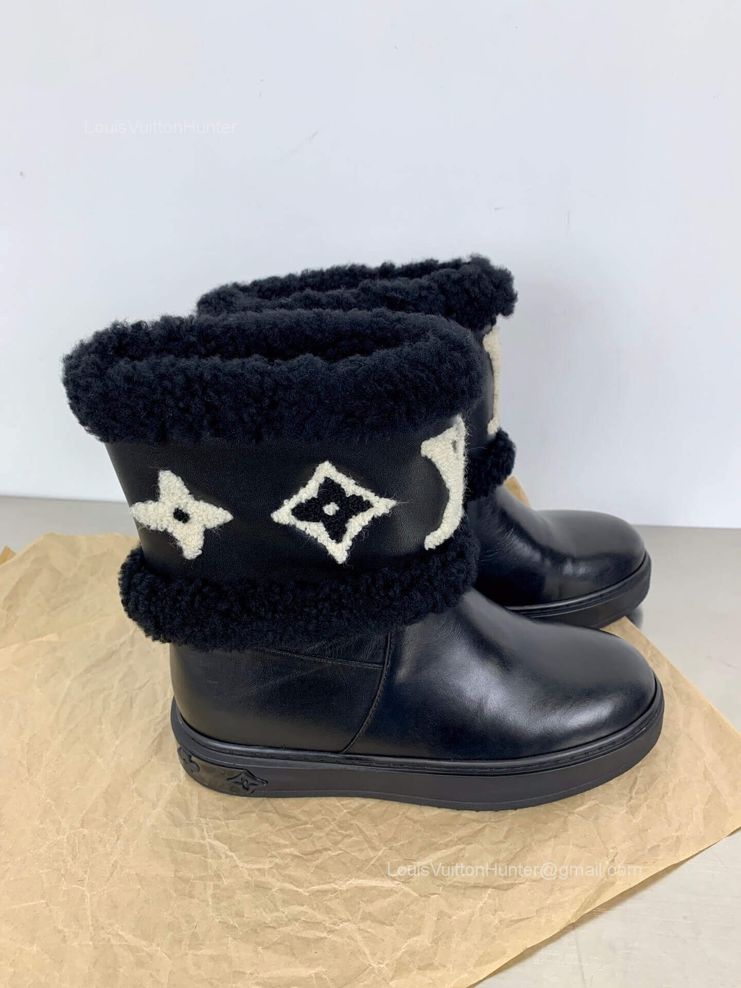 Louis Vuitton Snowdrop Flat Ankle Boot in Black Calf Leather and Shearling 2281662 Best Louis